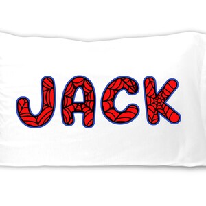 May include: White pillowcase with the name "JACK" in large, bold letters. The letters are red with a spiderweb design, outlined in blue. A fun and playful design for a child's bedroom.