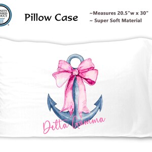 May include: White pillowcase with a blue anchor and a pink bow. The anchor has the text "Detta Gamma" written below it. The pillowcase measures 20.5 inches wide by 30 inches long.
