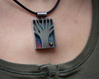 Tree pendant with faceted peridot | hand-cut and fabricated shadowbox | sterling silver with dark, colorful patina