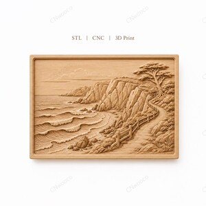 May include: A rectangular light brown wooden relief carving featuring a coastal landscape with a path, a fence, a large tree, rocky cliffs, and ocean waves. The text "STL | CNC | 3D Print" is centered above the carved rectangular panel.