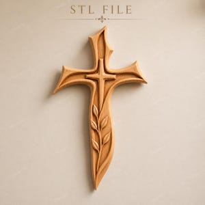Può includere: Una croce di legno con una croce più piccola al centro, con un disegno a foglie nella parte inferiore. La croce è in legno marrone chiaro e si trova su uno sfondo neutro. Il testo "STL FILE" è in alto.