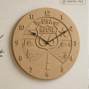 May include: A circular wooden wall clock featuring a carved Route 66 shield design with the text USA ROUTE 66, a desert landscape with cacti and rock formations, and black clock hands. The top text reads STL | CNC | 3D Print and DIGITAL FILE.