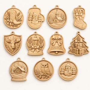 May include: A collection of eleven light-colored wooden ornaments featuring intricate relief carvings of holiday themes including a cowboy boot, snowman, church, stocking, moose, lantern, bell, gift-stacked tree, cabin, owl, and another snowman.
