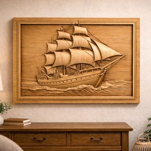 May include: A wooden relief carving of a sailing ship in a frame. The ship is depicted with detailed sails and is at sea. The artwork is mounted on a wall above a wooden dresser, creating a nautical theme.