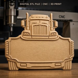 May include: A light brown wooden sign featuring a relief carving of a semi-truck cab at the top and a large blank rectangular space below. The text DIGITAL STL FILE | CNC | 3D PRINT is visible at the top of the image above the truck design.