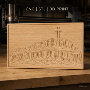 May include: A rectangular light-coloured wooden plaque featuring a CNC-carved relief of a desert mesa with a cross standing on the summit. The text CNC | STL | 3D PRINT is visible at the top, and the brand name CNwooco is in the bottom corner.