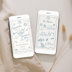 May include: Two white smartphones displaying blue line art wedding invitations. One phone reads "Seashells and Wedding Bells" with mermaid and seashell illustrations. The other phone shows event details with beach-themed icons. The phones rest on a beige fabric.