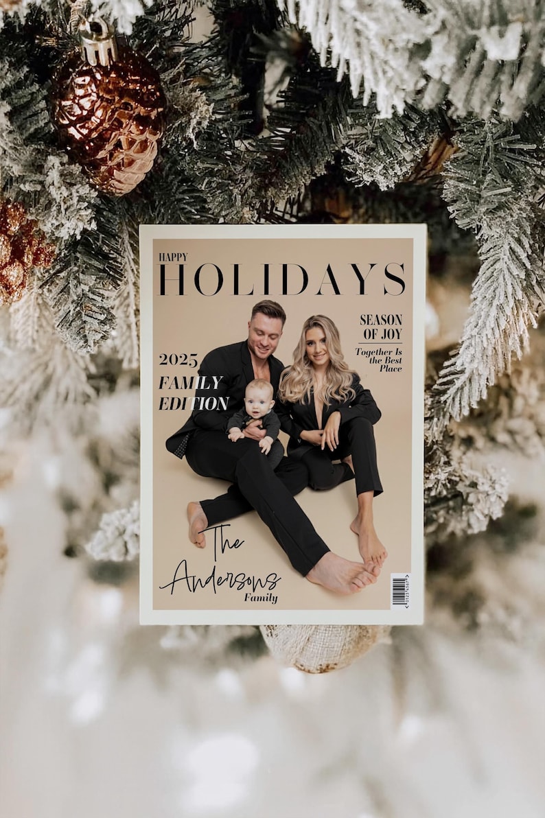 May include: A magazine cover with the headline "Happy Holidays" and the text "2025 Family Edition." The cover features a family of three in black outfits. The magazine is set against a backdrop of a Christmas tree with ornaments.