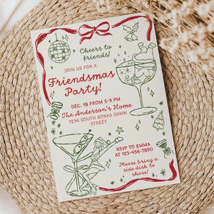 May include: A Friendsmas Party invitation with red and green illustrations on a cream background. The invitation includes text that says "Cheers to friends!" and "Join us for a Friendsmas Party!" with event details.