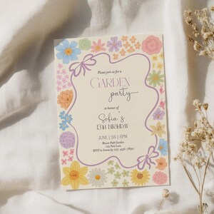 May include: A floral-themed invitation for a garden party in honor of Sofia's 13th birthday. The invitation features a purple border with a floral design and the text "Please join us for a GARDEN party in honor of Sofia's 13th Birthday. June | 26 | 1:30PM. Bloom Park Garden, 123 Petal Lane. RSVP to Emma by 123-456-7890."