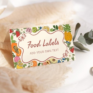 May include: A white card with a colorful fruit border and the text "Food Labels" in a red oval. Below the text is the phrase "Add your own text".