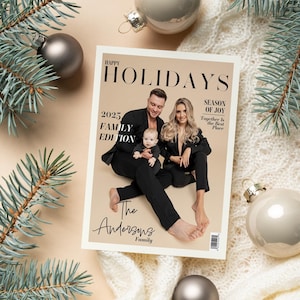 May include: A magazine cover with the text "Happy Holidays" and "2025 Family Edition" featuring a family of three. The cover is surrounded by Christmas ornaments and pine branches, with a cream-colored background.