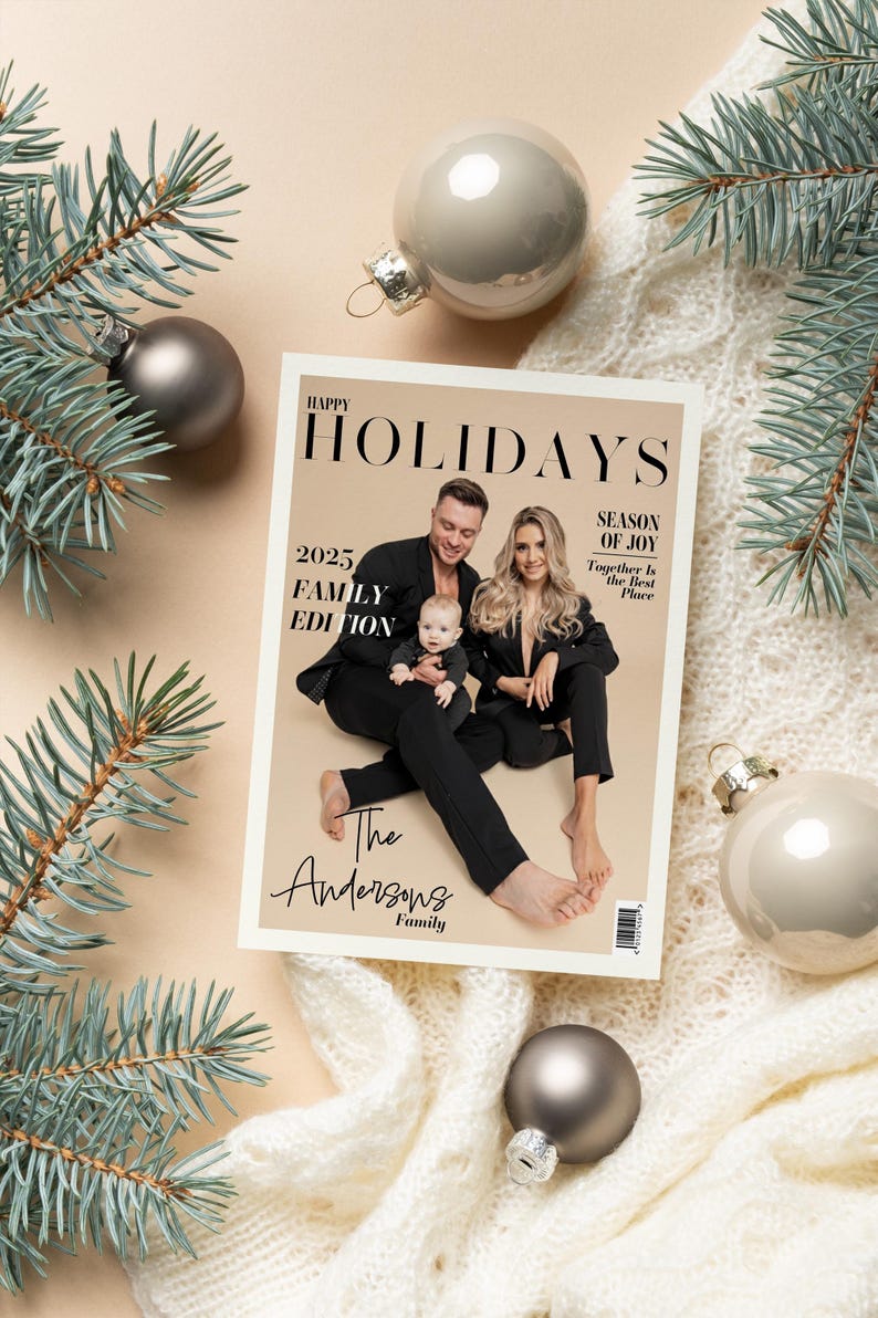 May include: A magazine cover with the text "Happy Holidays" and "2025 Family Edition" featuring a family of three. The cover is surrounded by Christmas ornaments and pine branches, with a cream-colored background.