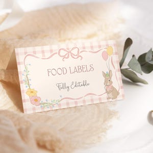 May include: Pink and white gingham food labels with a floral border and a cute bunny illustration. The text reads "Food Labels" and "Fully Editable".
