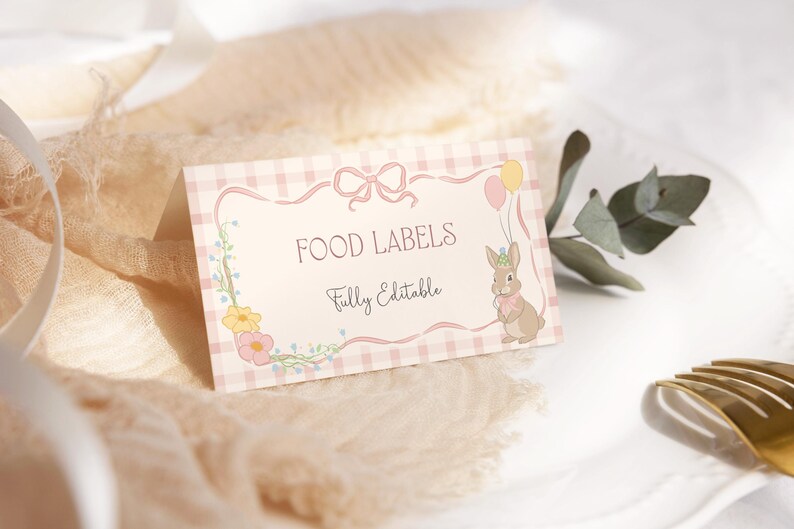 May include: Pink and white gingham food labels with a floral border and a cute bunny illustration. The text reads "Food Labels" and "Fully Editable".