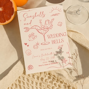 May include: A light pink invitation with the text "Seashells and Wedding Bells" and a mermaid illustration in a cocktail glass. The invitation includes details for a bachelorette weekend in Tulum, Mexico.