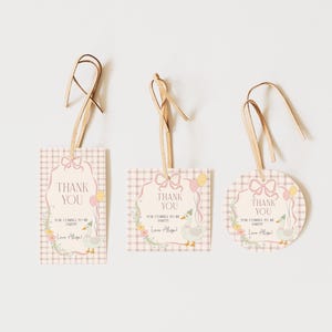 May include: Three pink and white thank you tags with a gingham pattern and a cute illustration of a duck with balloons. The text on the tags reads "Thank You for coming to my party Love [Name]"