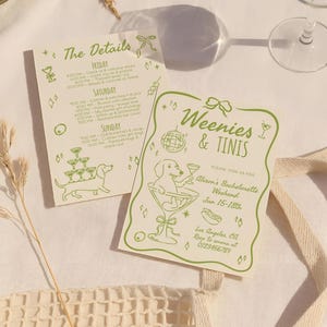 May include: Two invitation cards with green text and illustrations for a bachelorette weekend. One card says "Weenies & Tinis" and the other lists weekend details. A glass and papaya are in the background.
