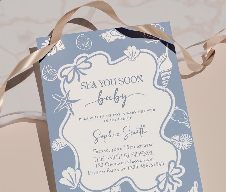May include: A baby shower invitation with a light blue background and white seashell illustrations. The invitation reads "SEA YOU SOON baby" and includes details for the event, such as the date, time, location, and RSVP information.