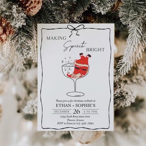 May include: A white invitation card with a black border and a bow at the top. The text "MAKING Spirit BRIGHT" is displayed. A cartoon Santa Claus is in a cocktail glass. The invitation is for Christmas cocktails.