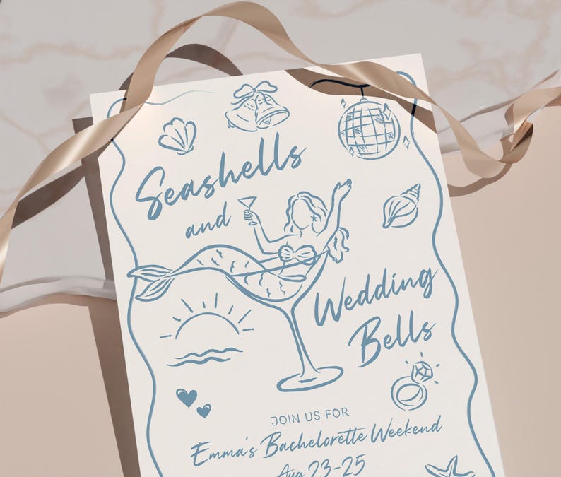 May include: A light cream-colored invitation with blue line art. The text reads "Seashells and Wedding Bells" with illustrations of a mermaid in a martini glass, seashells, and a disco ball. A gold ribbon is draped across the top.
