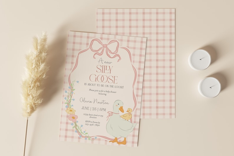 May include: A pink and white gingham baby shower invitation with a cartoon goose and a baby goose. The text on the invitation reads 'A new silly goose is about to be on the loose!'  'Please join us for a baby shower honoring Olivia Newton June 26 | 6PM 1234 down street or any direction RSVP to Emma by 123-456-7890'
