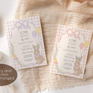 May include: Two pink and purple invitation cards with a gingham pattern. The cards feature a bunny rabbit with a birthday hat and balloons. The text on the cards reads "Some bunny is one." and "Ausa's First Birthday".