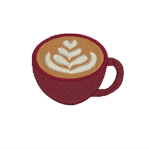 May include: A red coffee cup with a brown and white latte art design. The latte art is a leaf design.