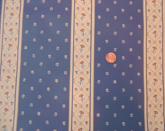 May include: Blue and white striped wallpaper with a floral pattern. The wallpaper has a repeating pattern of small white flowers on a blue background, with a thin white stripe and a thicker cream stripe with a red and white floral pattern.