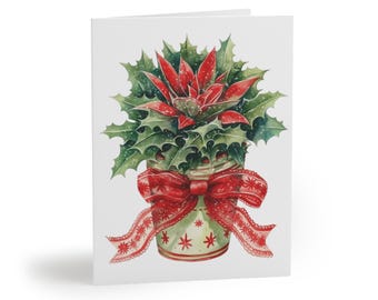 May include: A watercolor Christmas card featuring a festive arrangement. The design includes a red poinsettia and green holly in a decorative jar, tied with a red ribbon. The card is white with a glossy finish.