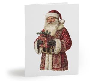 Può includere: Un biglietto di Natale con un'illustrazione vintage di Babbo Natale. Indossa un abito rosso con finiture in pelliccia bianca, un cappello abbinato e guanti neri. Babbo Natale tiene in mano un regalo avvolto, adornato con un rametto di verde. La carta ha uno sfondo bianco.