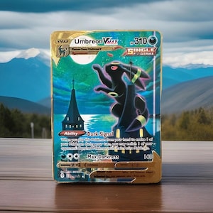 Carta Pokémon Umbreon VMAX 215/203 “Moonbreon” de metal dourado/colecionável