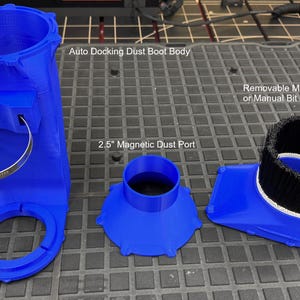 May include: A blue 3D printed dust boot for a CNC router with a 2.5 inch magnetic dust port, a removable magnetic base for automatic tool change or manual bit change, and a dust boot body.