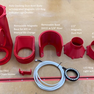 May include: A red plastic dust boot body with an integrated magnetic LED ring indicator light holder, a removable magnetic base for ATC or manual bit change, a removable base dock with a 5/8 inch riser, a 2.5 inch magnetic dust port, a 4 inch magnetic dust port, a white control cable, and a LED ring indicator light with a control cable.  *FULL Combo FREE Gift* Drag Chain Holder.