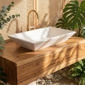 Lavabo rectangular de cerámica para baño, ideal para reformas del hogar.