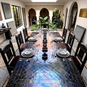 May include: A set of three ceramic mugs with a speckled, matte finish. The mugs are in cream, light grey, and dark grey. Each mug has a simple, minimalist design, ideal for coffee or tea.