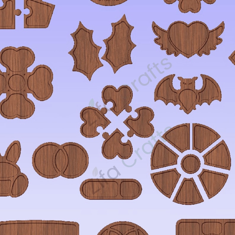 May include: A collection of brown wooden craft shapes featuring various designs including a winged heart, a bat, a circular segmented tray, puzzle pieces, holly leaves, and geometric forms. The wood grain is visible on each flat, laser-cut piece.