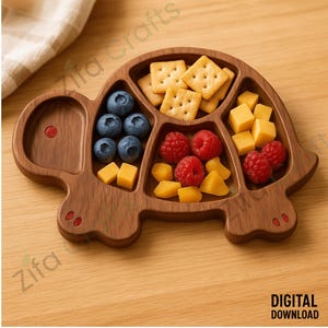 May include: A wooden turtle-shaped serving tray filled with snacks. The tray is divided into sections containing blueberries, raspberries, cheese cubes, mango chunks, and crackers. The tray has a digital download label.