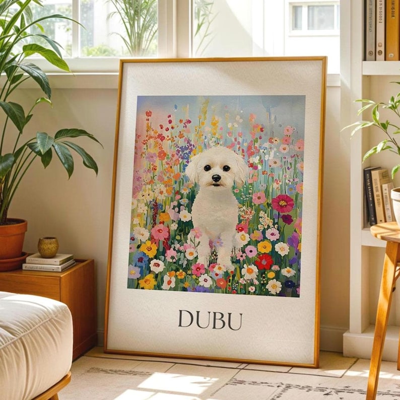 May include: A framed art print depicting a white dog amidst a vibrant flower field. The artwork is framed with a light beige border, and the dog's name, "DUBU," is printed at the bottom. The background is a mix of pink, yellow, and blue.