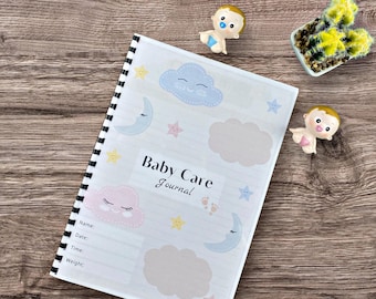 May include: A spiral-bound baby care journal with a white cover featuring pastel clouds, stars, and moons. The journal has lined pages for recording baby's name, date, time, and weight. The words "Baby Care Journal" are printed on the cover.