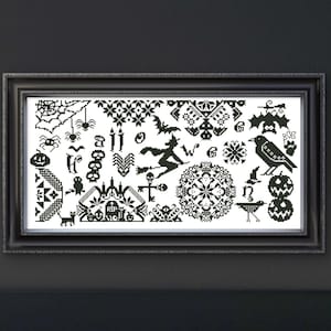 May include: Framed black and white cross-stitch art featuring Halloween-themed motifs. The design includes a witch on a broom, pumpkins, bats, spiders, and a crow. The artwork is displayed in a black frame.