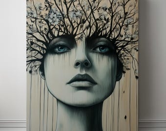 May include: A canvas print featuring a portrait of a face with blue eyes and dark, dripping ink-like lines. The top of the head transitions into a dense network of bare branches adorned with small white flowers against a beige background.