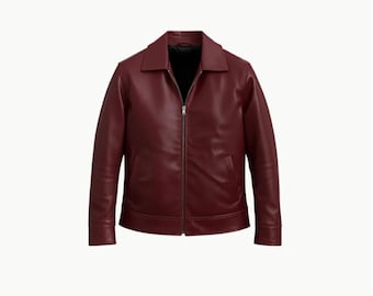 May include: A burgundy leather jacket with a collared neckline and a full-length zip. The jacket features two front pockets and long sleeves. The interior lining is black.