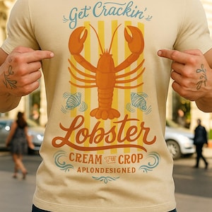 Lobster Graphic T-Shirt – Retro Get Crackin’ Summer Tee, Unisex Coastal Shirt, Nautical Beach Party Shirt, Funny Seafood Lover Gift