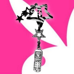 May include: A silver charm necklace with a star and flip phone pendant. The necklace includes a zebra-striped star, a rhinestone-studded star, and a small black star. The flip phone pendant is detailed with buttons and a screen.