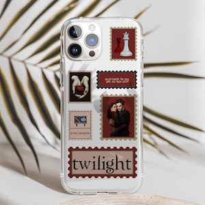 May include: Clear phone case with a collage of images and text. The images include a chess piece, a hand holding an apple, and a couple embracing. Text includes "twilight" and "Bella! Where the hell have you been loca?"