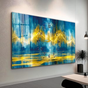 May include: Large rectangular wall clock with a blue and yellow abstract design. The clock face features black numerals and gold hands. The background has a textured, wood-like appearance.