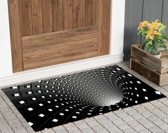 Moderne 3D-illusie deurmat, zwarte geometrische voordeurmat, abstract optisch buitentapijt, minimaal decor hal, gedurfd hedendaags welkom