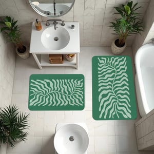 Moderner Badezimmerteppich, grün gemusterte Matte, natürliche Pflanzennote, erfrischende Atmosphäre, minimalistisches Design, elegante Details, komfortabel in der Anwendung
