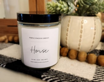 Horse Soy Candle ~  Notes of soft Earth, fresh alfalfa, and clean horses with well worn leather and a hint of sawdust.